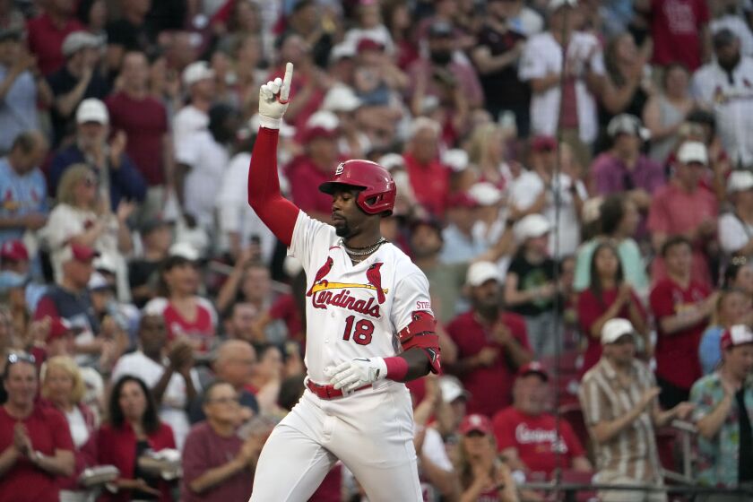 St. Louis Cardinals' Jordan Walker celebrates after hitting a two-run home run during the second inning of a baseball game against the Cincinnati Reds Friday, June 9, 2023, in St. Louis. (AP Photo/Jeff Roberson)