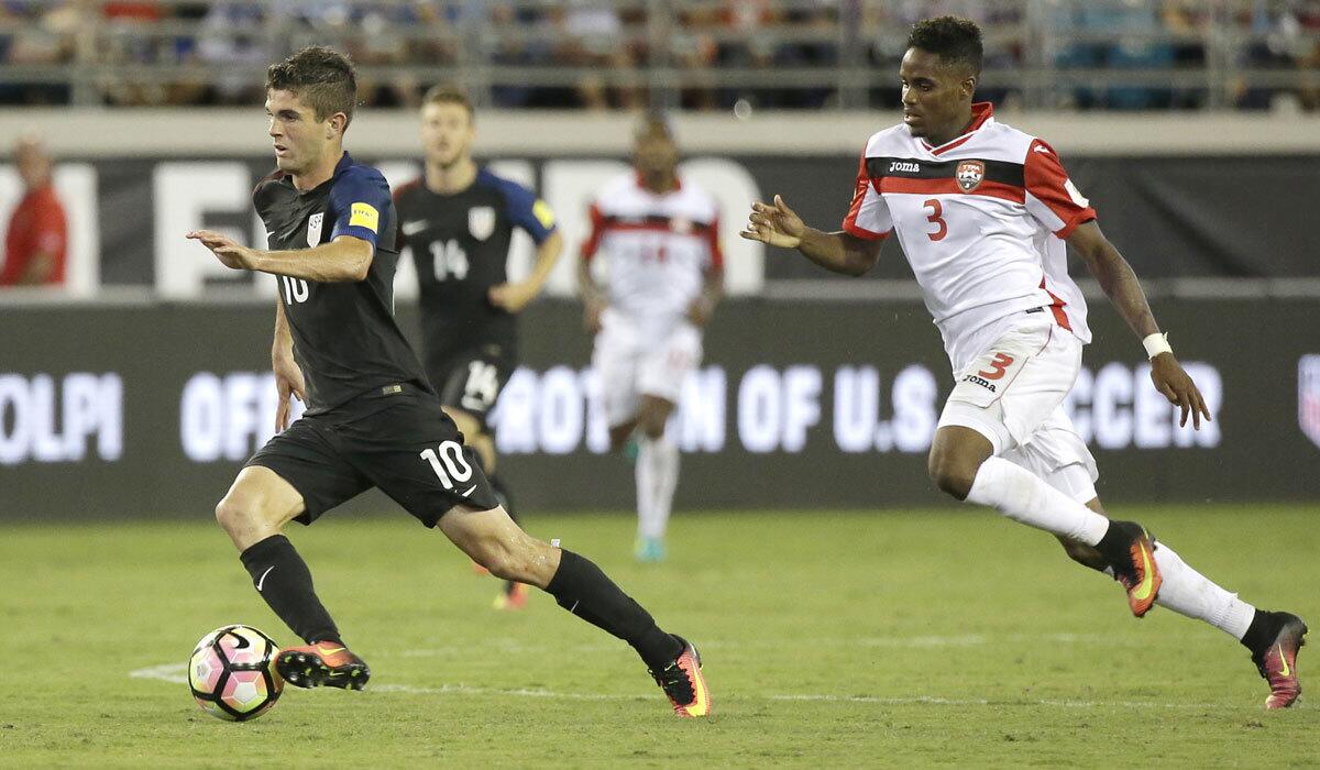 Christian Pulisic of the U.S. moves the ball past Trinidad & Tobago's Joevin Jones on Sept. 6.