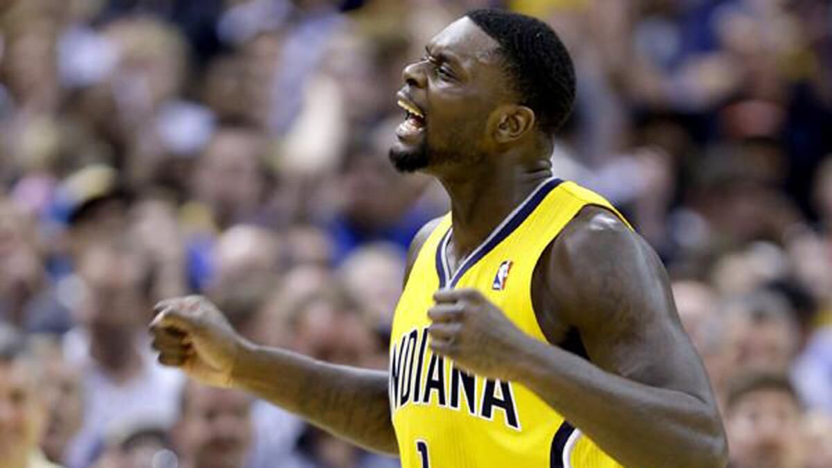 Pacers guard Lance Stephenson celebrates after scoring late in the game against the Thunder on Sunday afternoon in Indianapolis.