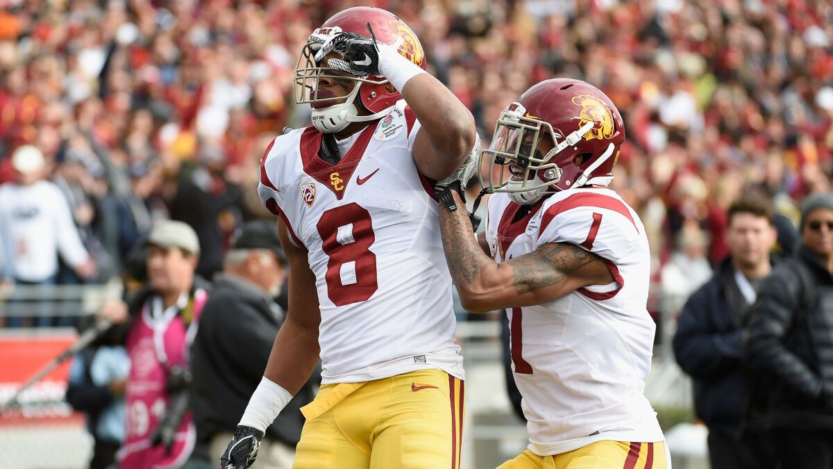 USC defensive back Iman Marshall (8) celebrates with teammate Jack Jones (1) after intercepting a pass during the first quarter against Penn State in the Rose Bowl on Jan. 2.