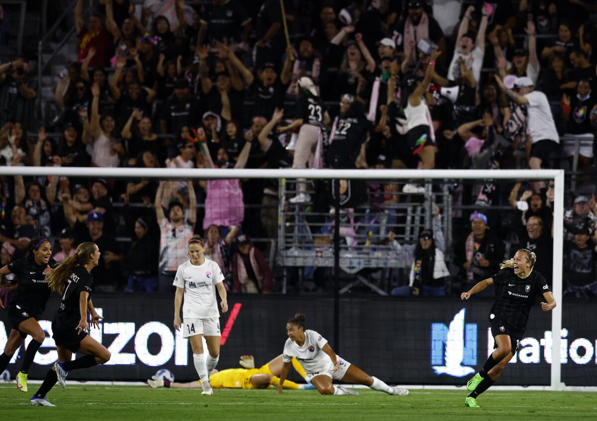 Angel City's Claire Emslie, right, celebrates her goal against the San Diego Wave FC on July 9, 2022.