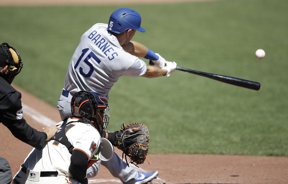Austin Barnes connects for a two-run double against the San Francisco Giants on Aug. 27.