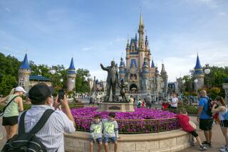 FILE - People visit the Magic Kingdom Park at Walt Disney World Resort in Lake Buena Vista, Florida, on April 18, 2022. Florida lawmakers will meet Monday, Feb. 6, 2023, to complete a state takeover Walt Disney World's self-governing district and debate proposals on immigration and election crimes, as Republican Gov. Ron DeSantis continues to leverage national political fissures ahead of an expected White House run. (AP Photo/Ted Shaffrey, File)