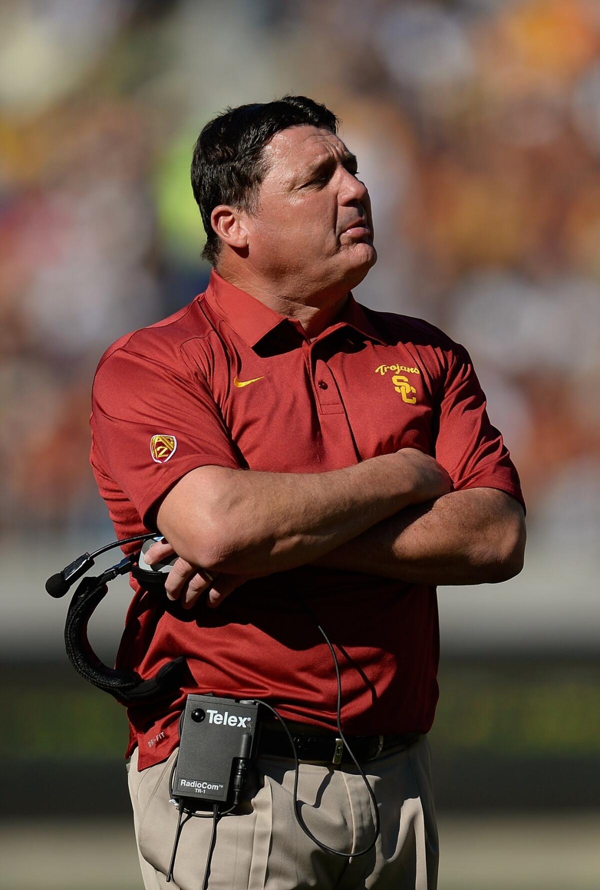 USC Interim Coach Ed Orgeron says stopping UCLA quarterback Brett Hundley from running the ball and making long passes will be crucial to the Trojans' success on Saturday.