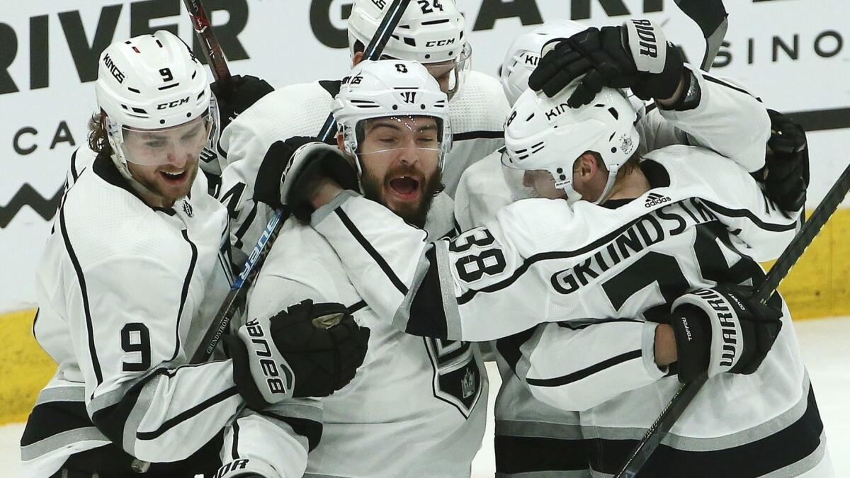 Los Angeles Kings forward Carl Grundstrom (38) celebrates with teammates after scoring against the Arizona Coyotes on Saturday.