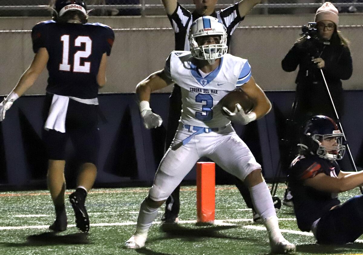 Corona del Mar's Mason Kubichek (3) celebrates after scoring in the CIF Southern Section Division 3 football semifinal game.