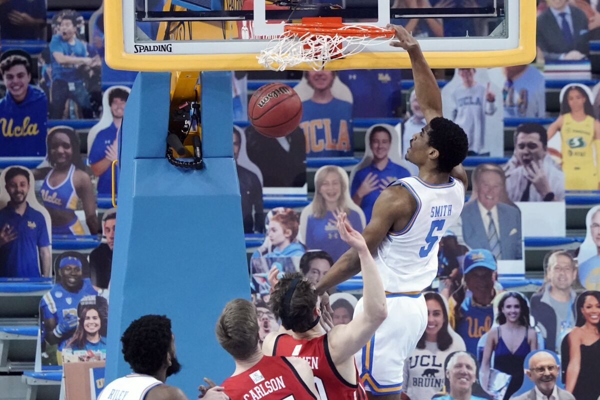 UCLA guard Chris Smith dunks during the Bruins' 72-70 victory over Utah at Pauley Pavilion.
