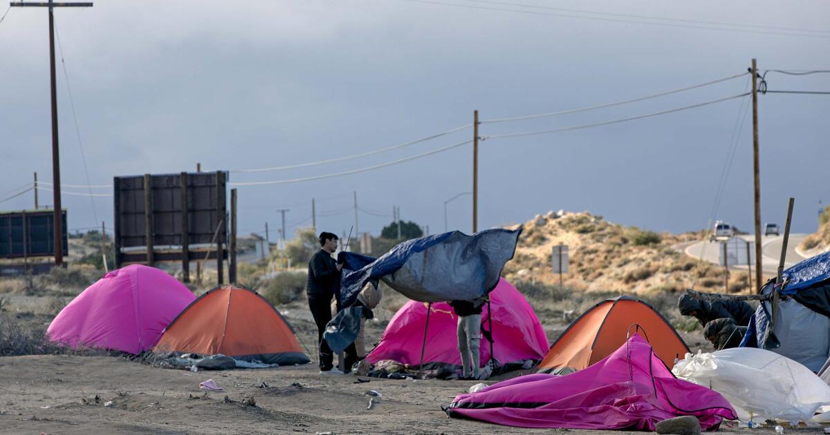 On the edge of Interstate 8, migrants shelter in pink tents as winter bears down