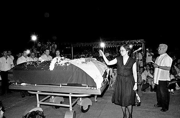 Corazon C. Aquino, the unassuming housewife who toppled a dictator and restored democracy to the Philippines as its 11th president, died July 31, 2009. She is seen here sprinkling holy water on the coffin of her husband, opposition leader Senator Benigno Aquino during his funeral services in Manila on Aug. 31, 1983.