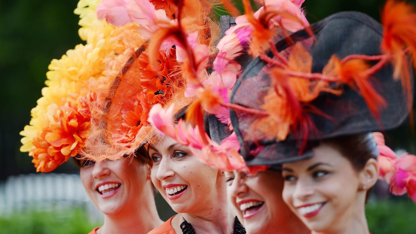 Race-goers show off their hats on the opening day of Royal Ascot near London.