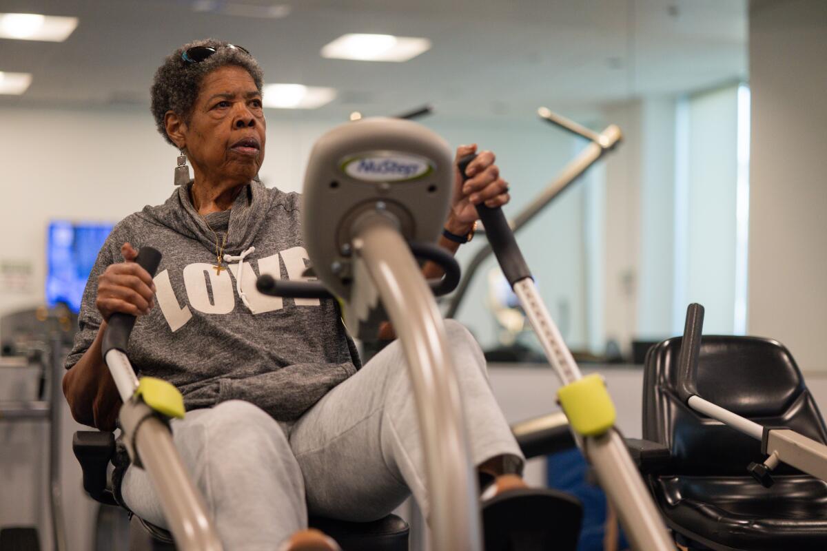 Christina Shannon works out on a stationary bike