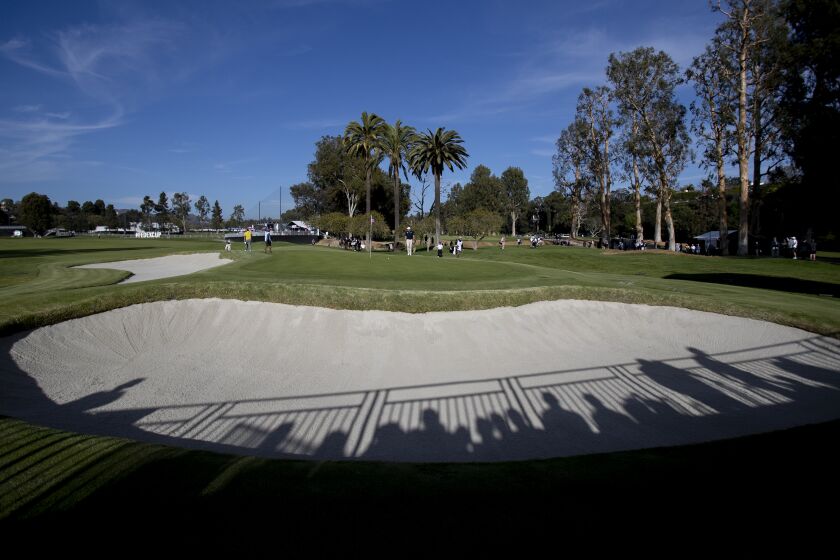 PACIFIC PALISADES, CA - FEBRUARY 13, 2020: Shadows of the gallery fall into one of the many sand traps surrounding the 10th hole during Round 1 of the Genesis Open at Riviera Country Club on February 13, 2020 in Pacific Palisades, California. Many golfers drive for the green on this hole.(Gina Ferazzi/Los AngelesTimes)