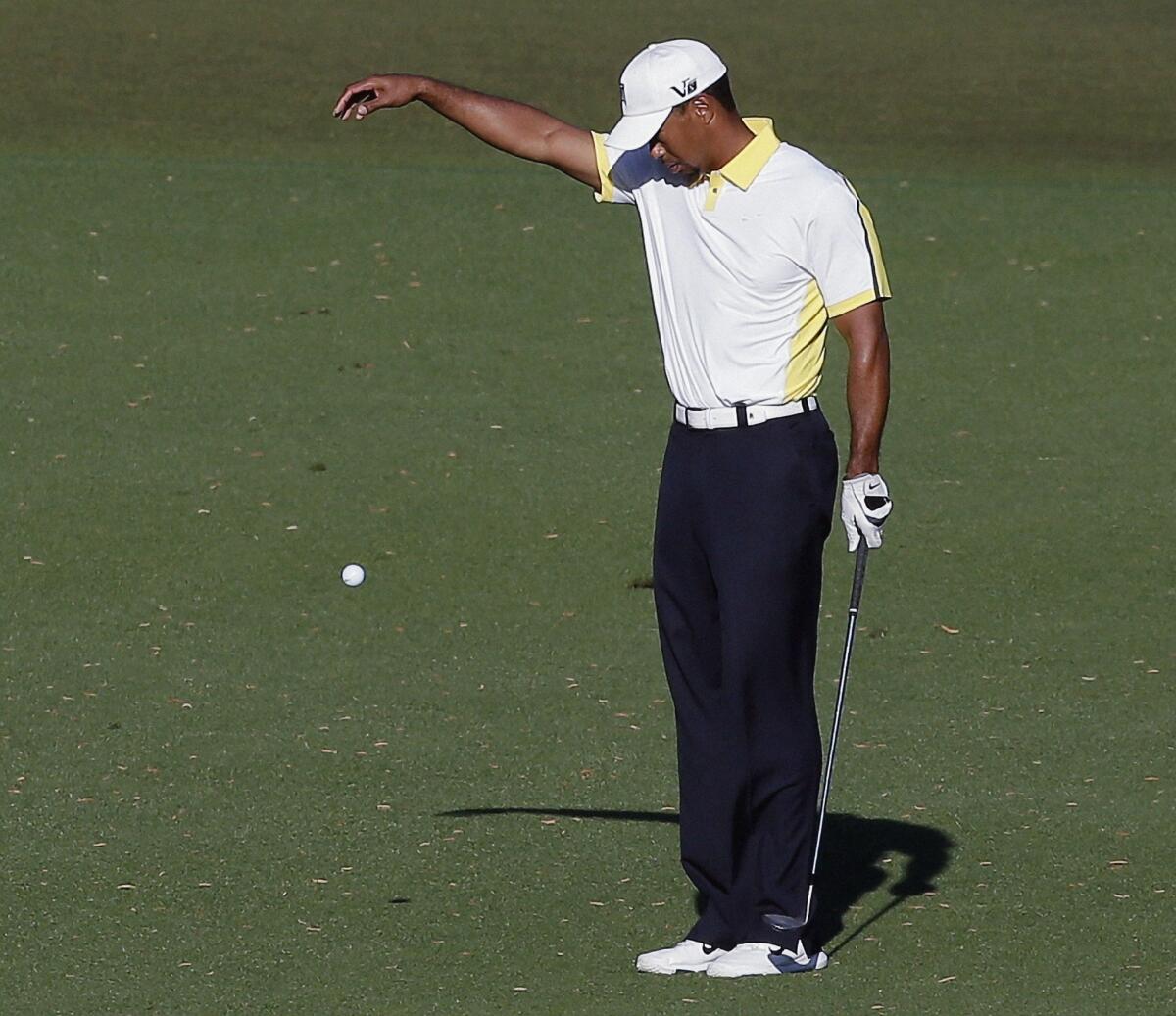 Tiger Woods takes a drop on the 15th hole after his ball went into the water during the second round of the Masters golf tournament in April.