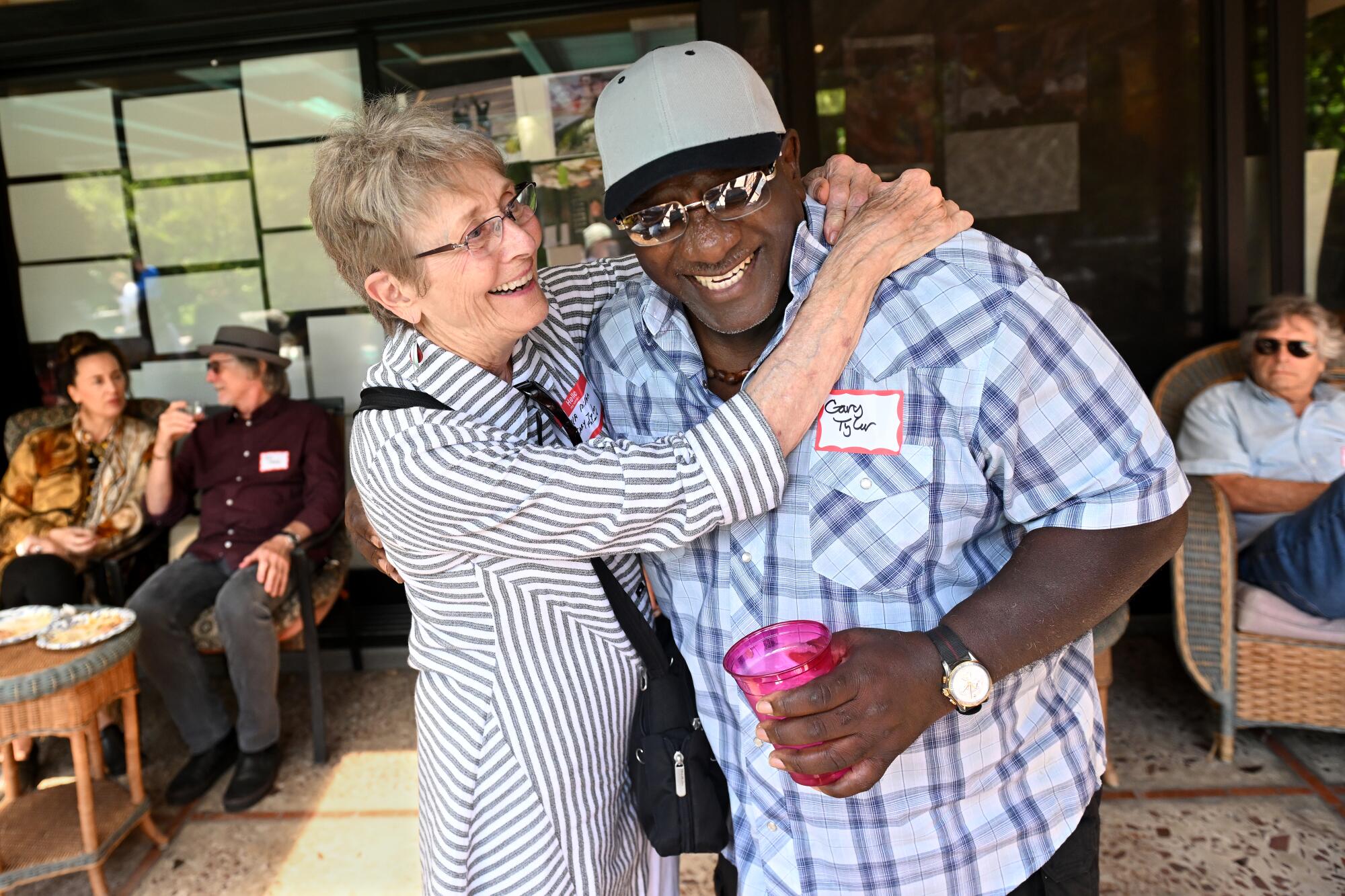 Gary Tyler hugs friend Tekla Miller during a reunion party in Santa Monica.