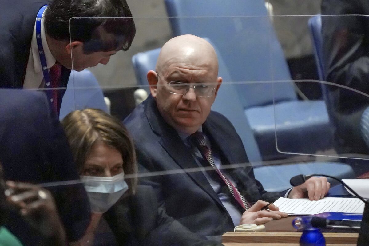 Russia Ambassador Vassily Nebenzia, right, confers during a meeting of the United Nations Security Council on the humanitarian crisis in Ukraine, Thursday March 17, 2022 at U.N. headquarters. (AP Photo/Bebeto Matthews)