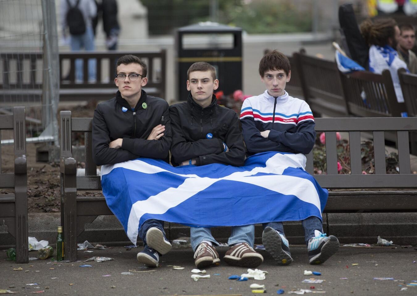 Independence supporters mull their defeat in George Square in Glasgow, Scotland.