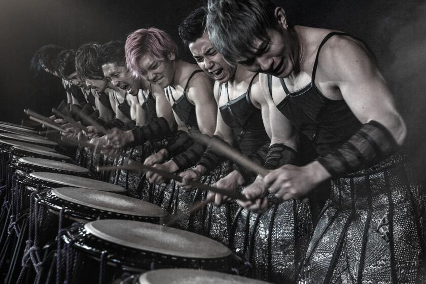 Drum Tao performers playing in unison.