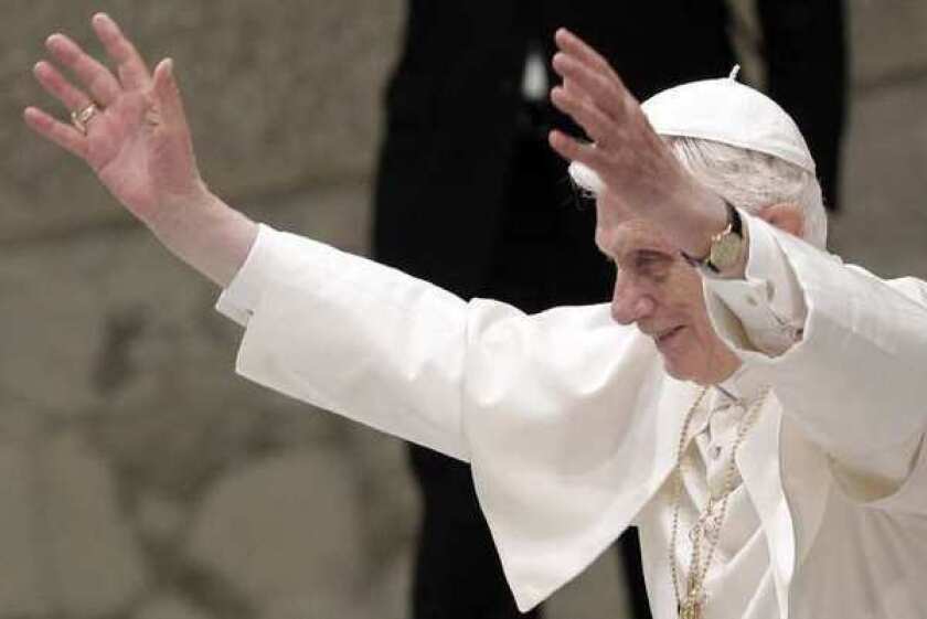 Pope Benedict XVI waves. The Vatican reported its worst deficit in years.
