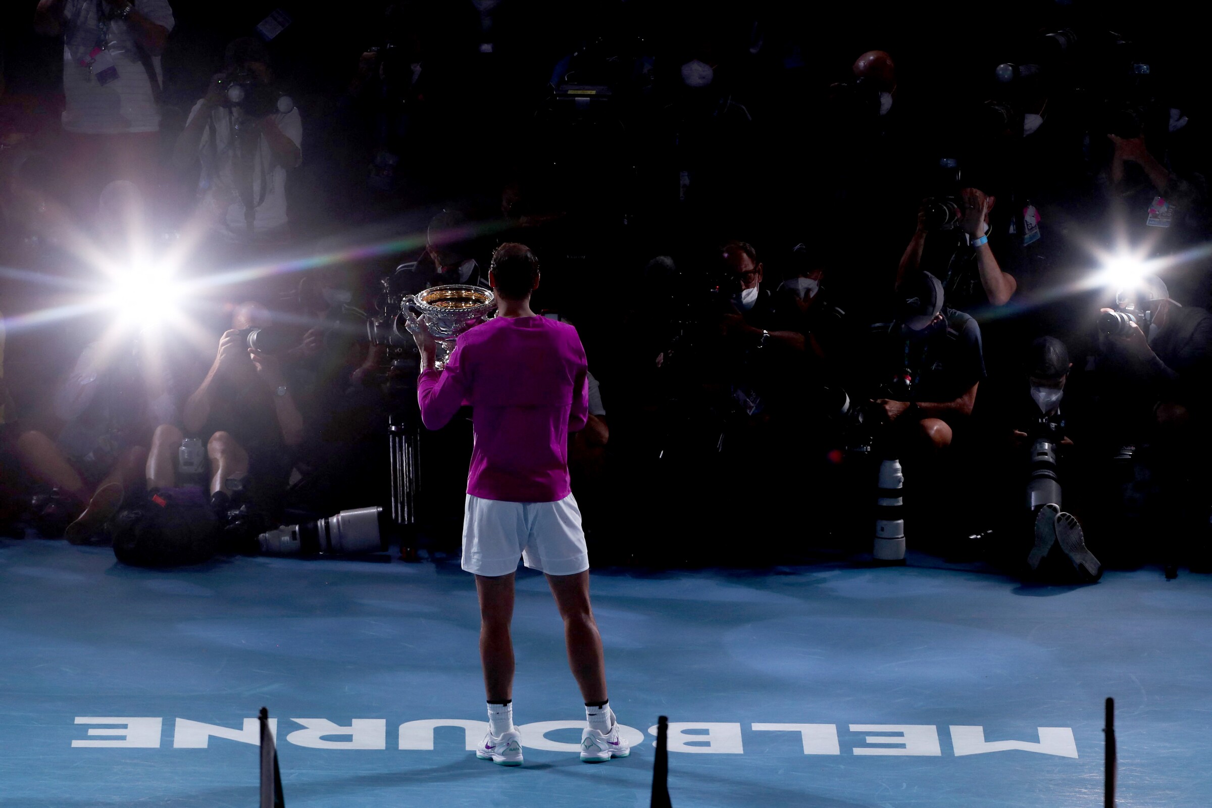 Spain's Rafael Nadal holds the Norman Brookes Challenge Cup trophy.