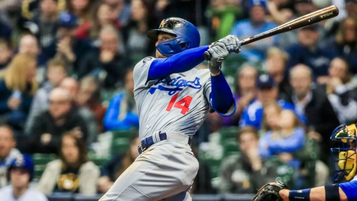 Dodgers' Enrique Hernandez hits a three-run home run in the eighth inning against the Milwaukee Brewers at Miller Park in Milwaukee.