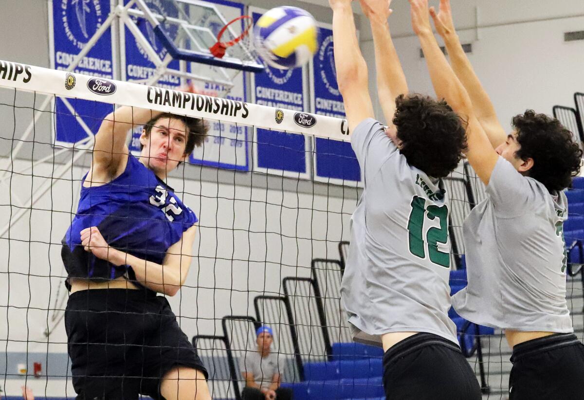 Sage Hill's Jackson Cryst (12) and Omar Al-Khatib (7) block San Marino's Luca Moggio (32) in the CIF Division 5 final.