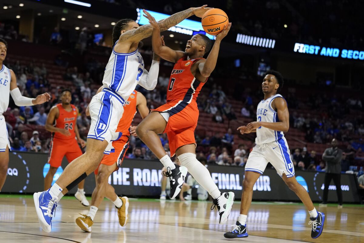 Duke forward Theo John blocks a shot by Cal State Fullerton guard Jalen Harris.