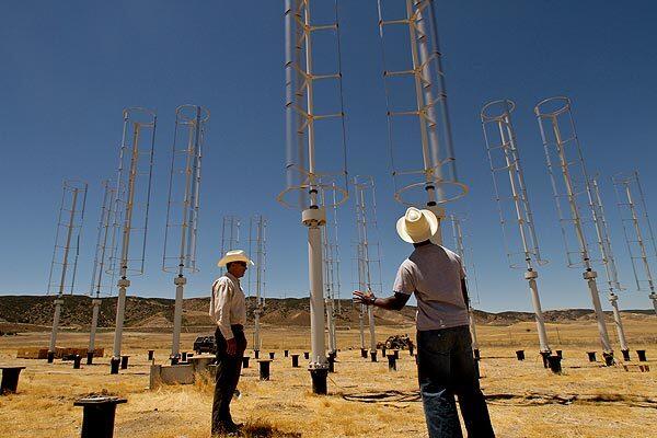 Bob Hayes, president of Prevailing Wind Power, and Caltech professor John O. Dabiri discuss where to place a device that measures wind speed at the Caltech field test of turbines in the Antelope Valley.