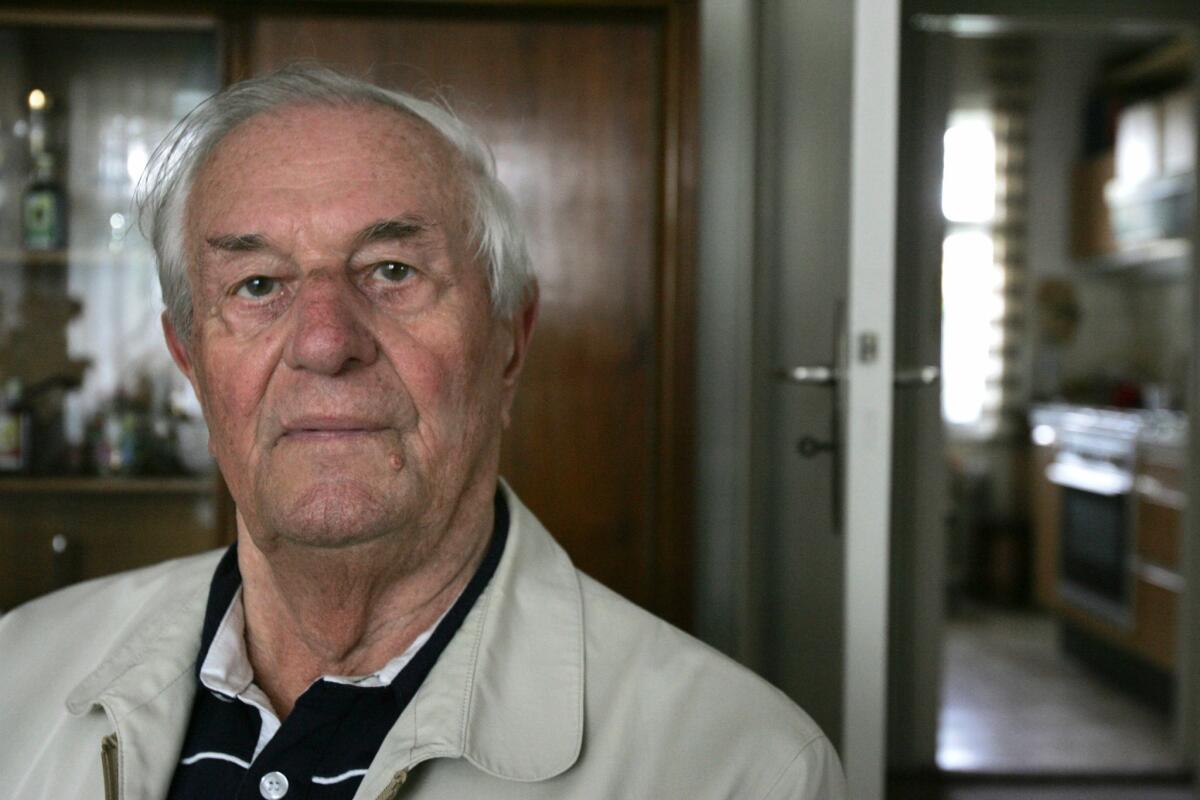 A picture taken on 2 May 2005 shows Rochus Misch, former staff sergeant in the Nazi SS with responsibility for maintaining the telephone lines in the bunker of Nazi Party's leader Austrian-born German Adolf Hitler, sitting in his home in Berlin. Misch, who served as Hitler's devoted bodyguard for most of World War II and was the last remaining witness to the Nazi leader's final hours in his Berlin bunker, died on September 5, 2013 in the age of 96.
