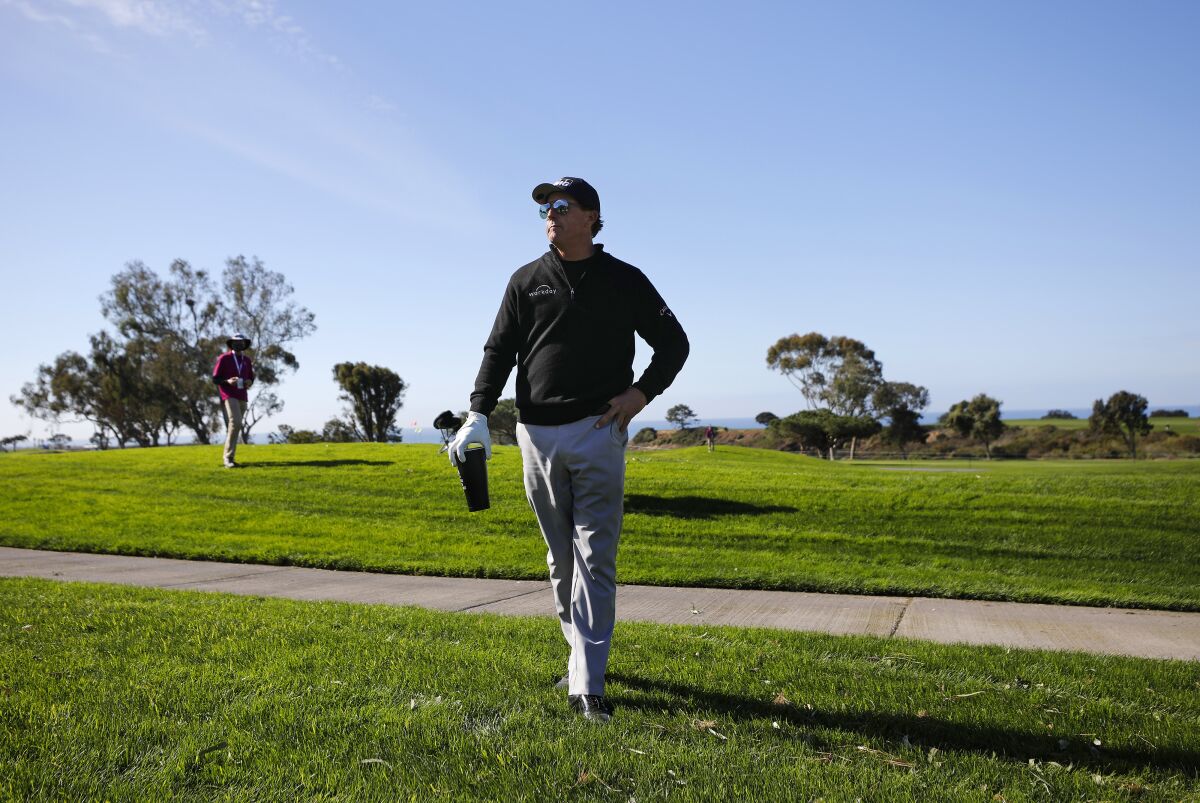 Phil Mickelson stands on the 18th hole during the Pro-Am at Torrey Pines in the Farmers Insurance Open last January.
