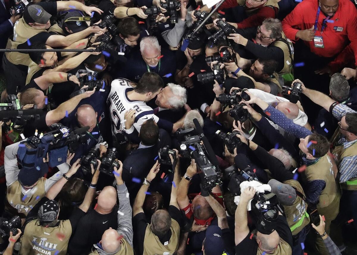 FILE - New England Patriots' Tom Brady embraces Patriots owner Robert Kraft after the NFL Super Bowl 53 football game against the Los Angeles Rams, Feb. 3, 2019, in Atlanta. The Patriots won 13-3. Tom Brady has retired after winning seven Super Bowls and setting numerous passing records in an unprecedented 22-year-career. He made the announcement, Tuesday, Feb. 1, 2022, in a long post on Instagram. (AP Photo/Morry Gash, File)