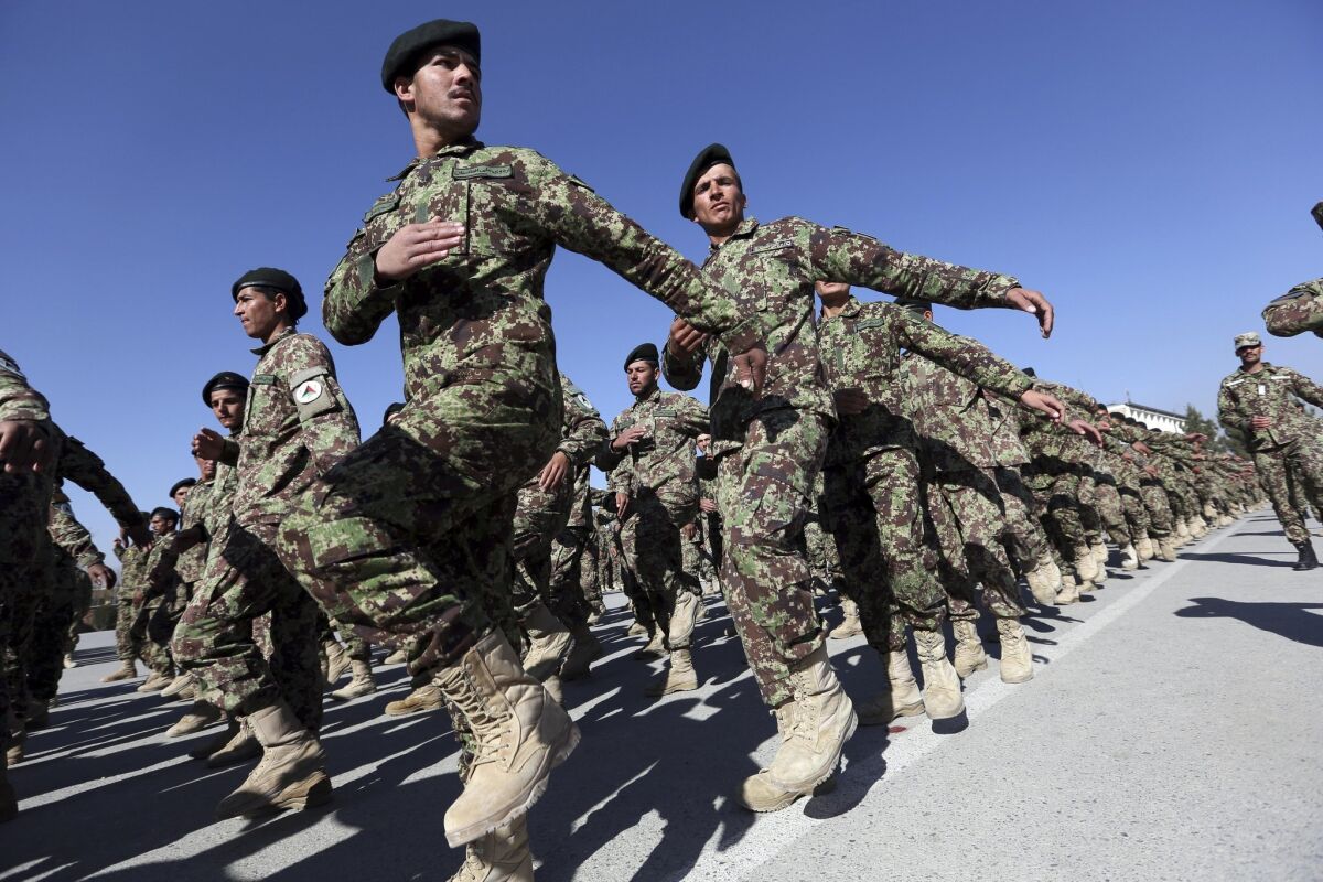 New soldiers march during graduation at the Afghan Military Academy in Kabul on Nov. 23.