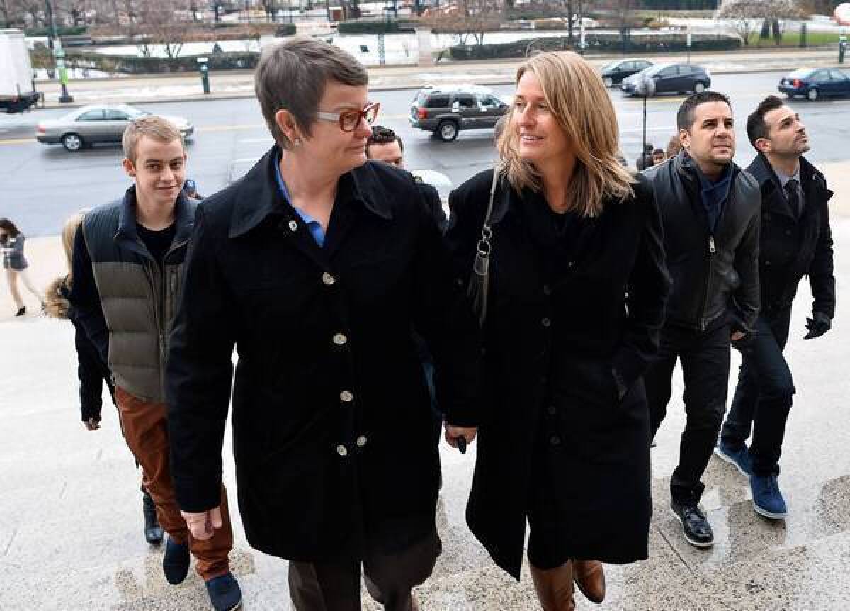 Plaintiffs Kris Perry, left, Sandy Stier, Paul Katami and Jeff Zarrillo climb the steps of the National Archive in Washington, D.C., on Monday. The four are plaintiffs in the Prop. 8 challenge, Hollingsworth vs. Perry.