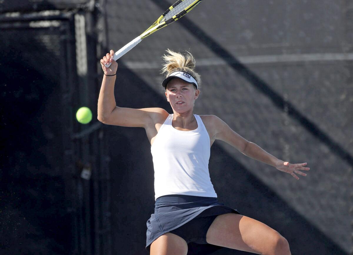 Jane Paulsen, shown playing against Laguna Beach earlier this season, helped the CdM girls' tennis team beat Los Alamitos.