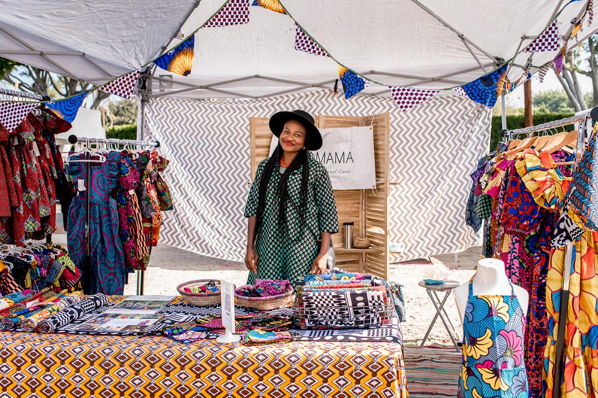 A vendor sells African clothing