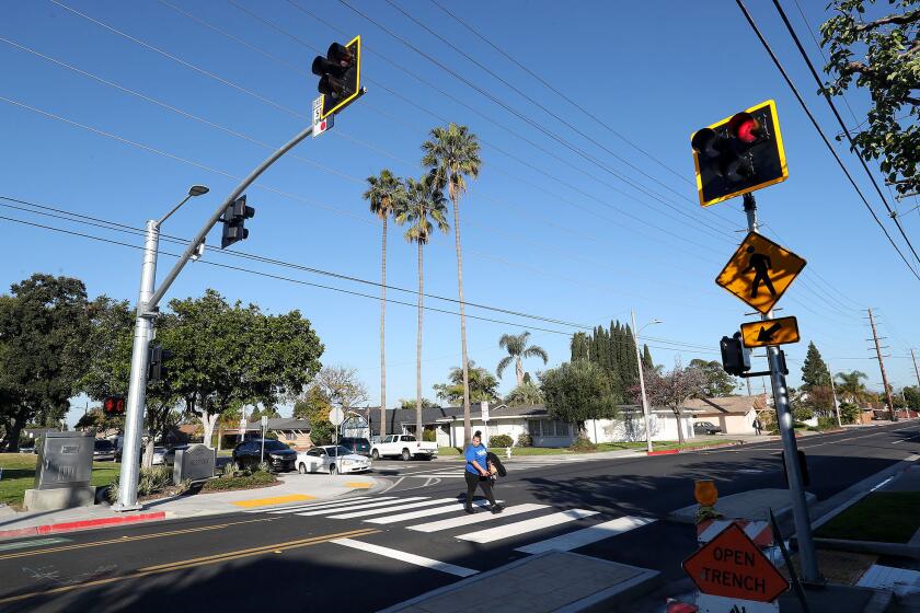 Costa Mesa city officials announced the completion of a new High-Intensity Activated CrossWalK or HAWK signal at the busy intersection of Wilson Street and Fordham Drive near Wilson Park in Costa Mesa on Friday.