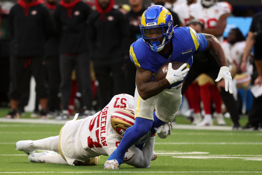 INGLEWOOD, CALIFORNIA - JANUARY 09: Cam Akers #23 of the Los Angeles Rams evades a tackle by Dre Greenlaw.