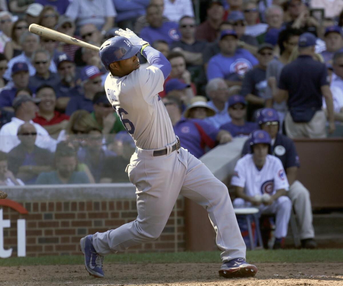 Yasiel Puig hits a three-run home run off of Cubs reliever Dan Straily in the sixth inning. The Dodgers beat Chicago, 14-5.