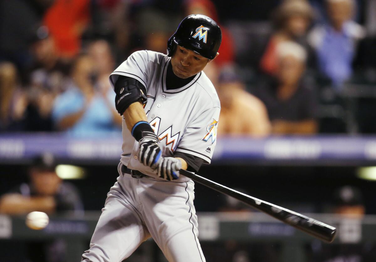 Marlins outfielder Ichiro Suzuki swings at a pitch against the Colorado Rockies during the ninth inning on Aug. 6.