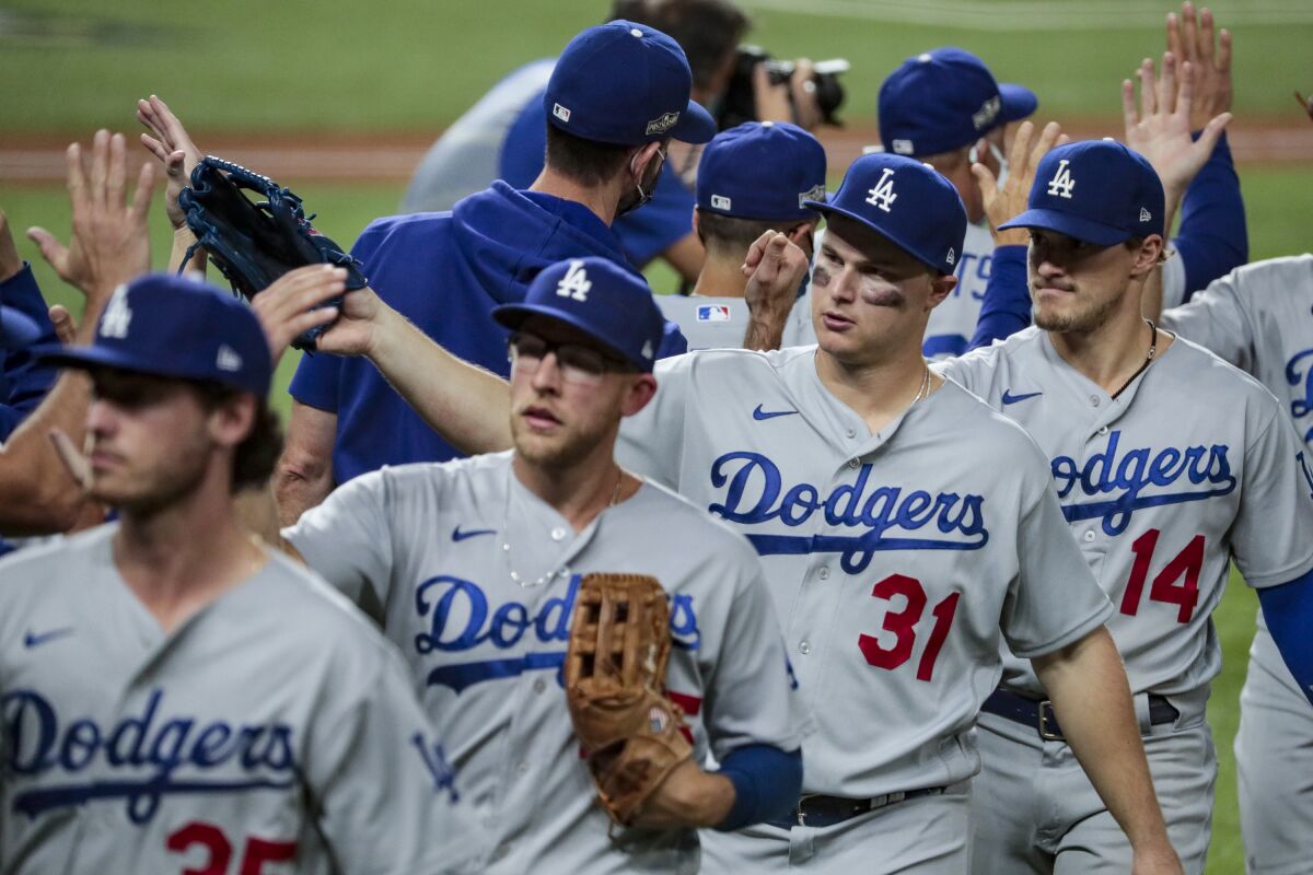Dodgers players celebrate after their win over the Atlanta Braves in Game 3 of the National League Championship Series.