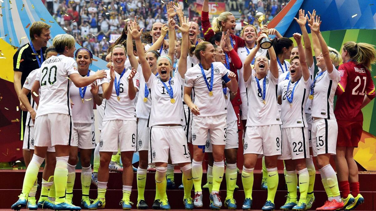 Members of the U.S. women's soccer team celebrate after defeating Japan in the World Cup final in Vancouver on July 5, 2015.