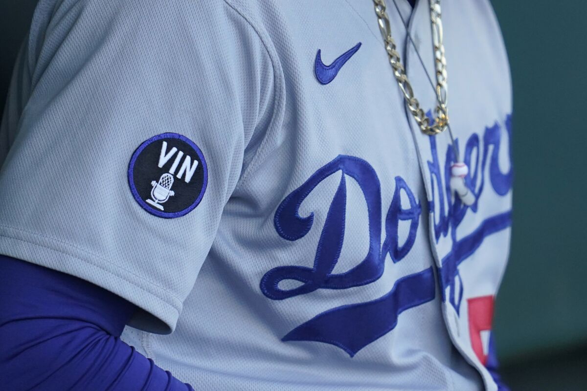 A patch honoring broadcaster Vin Scully is shown on the jersey of Mookie Betts during Wednesday's game.
