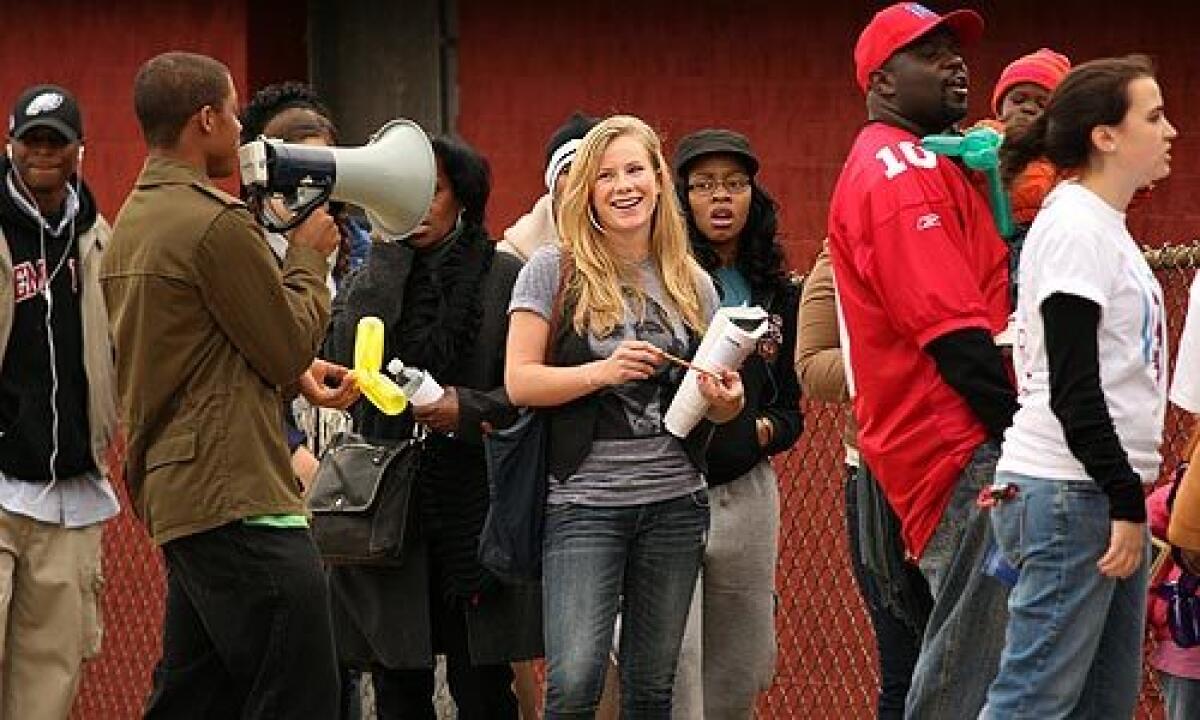 Voters from Temple University and other residents of the area line up to vote in Philadelphia. Student supporters of Barack Obama walks the line encouraging voters to wait despite the delay. More photos >>>