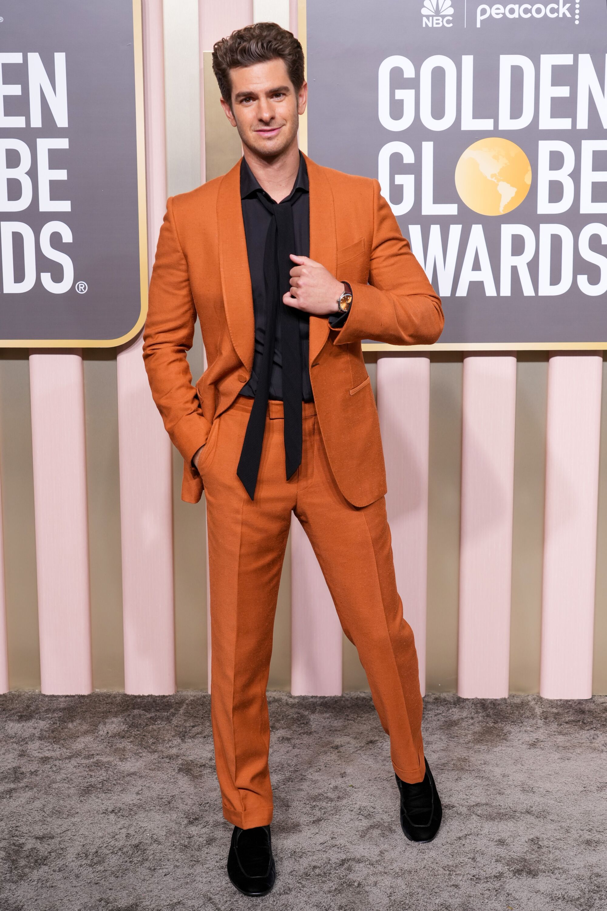 Andrew Garfield looks amazing in an orange Zegna suit.