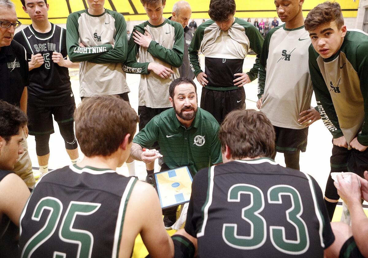 Sage Hill School coach Billy Conlon gives his team final instructions late in the game of a CIF Southern Section Division 5AA quarterfinal playoff game at Yeshiva University on Thursday.