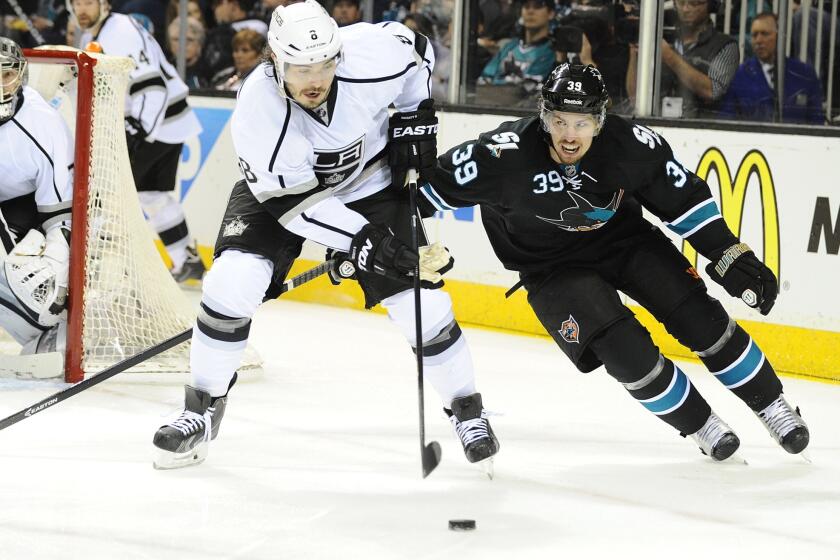 Kings defenseman Drew Doughty, left, and San Jose Sharks forward Logan Couture during the Kings' 3-0 win in Game 5 of the Western Conference quarterfinals.