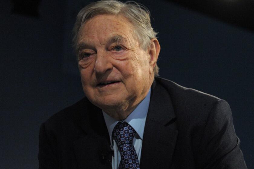 (FILES) In this file photo taken on January 26, 2013 Soros Fund Management Chairman George Soros poses on January 26, 2013, during the World Economic Forum (WEF) meeting in the Swiss resort of Davos. - An explosive device was found on Monday, October 22, 2018, in a mailbox at billionaire philantropist George Soros' home in Wetchester County, authorities said. The device was detonated by a bomb squad after the Bedford Police Department received a call about a suspicious package. "An employee of the residence opened the package, revealing what appeared to be an explosive device" the police said in a statement. Soros, who is a regular target of right-wing groups, was not at home at the time. (Photo by Eric PIERMONT / AFP)ERIC PIERMONT/AFP/Getty Images ** OUTS - ELSENT, FPG, CM - OUTS * NM, PH, VA if sourced by CT, LA or MoD **