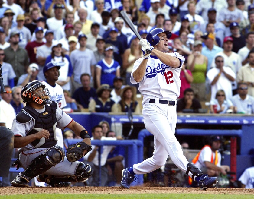Dodgers' Steve Finley hits a grand slam in the ninth inning against the San Francisco Giants on Oct. 2, 2004.