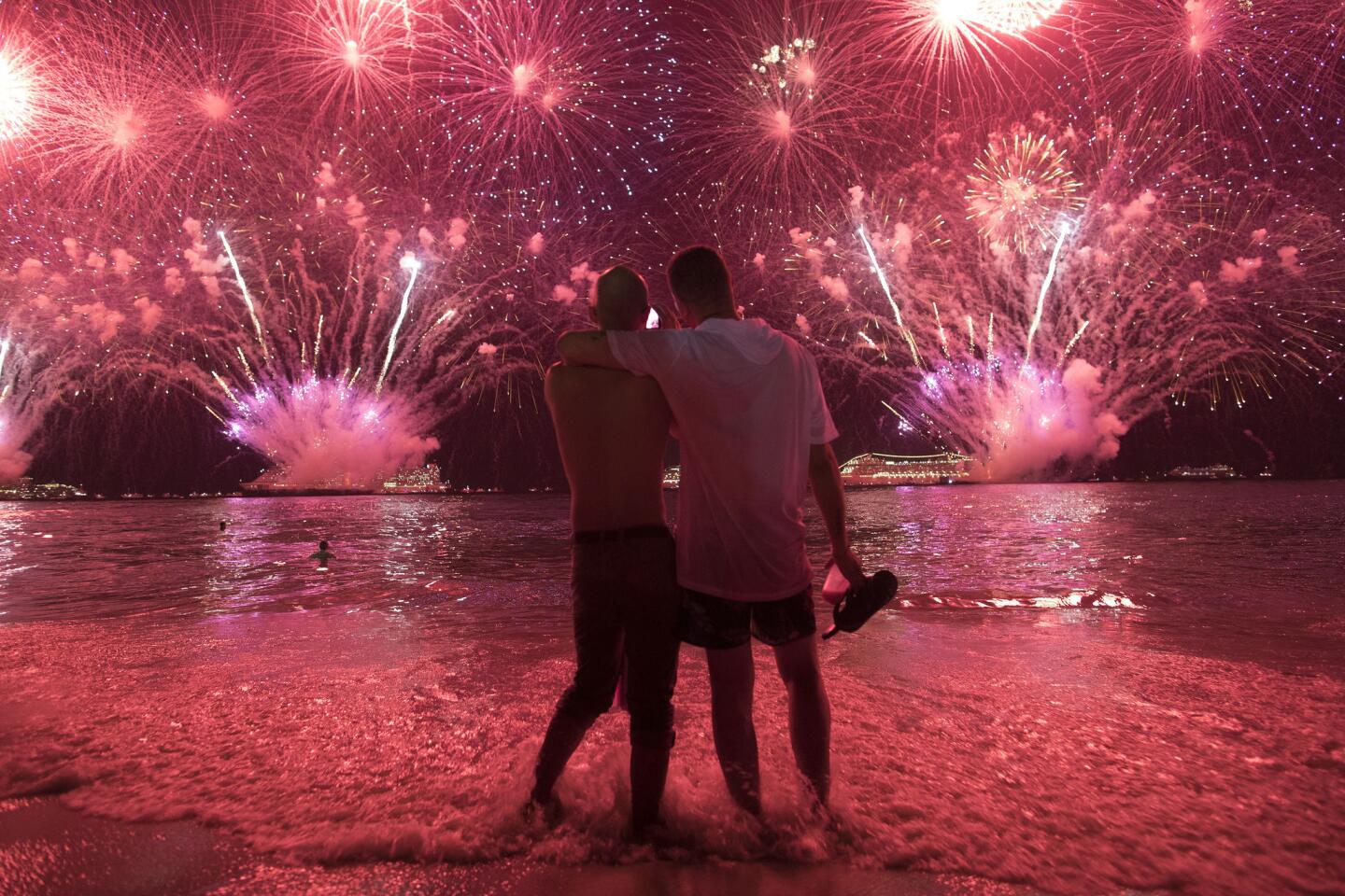 Fireworks explode over Copacabana Beach just after midnight during the New Year's celebrations in Rio de Janeiro.