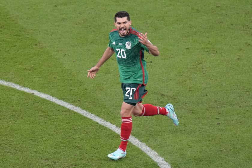 Mexico's Henry Martin celebrates after scoring the opening goal during the World Cup group C soccer match vs Saudi Arabia
