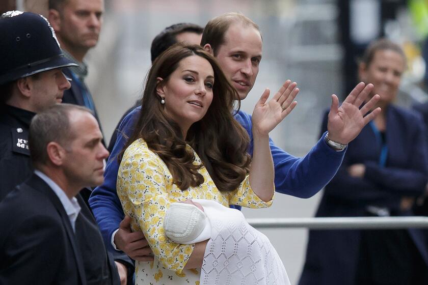 Britain's Prince William and Catherine, the Duchess of Cambridge, with their newborn daughter, wave to the public as they leave St. Mary's Hospital's Lindo Wing in London on Saturday.